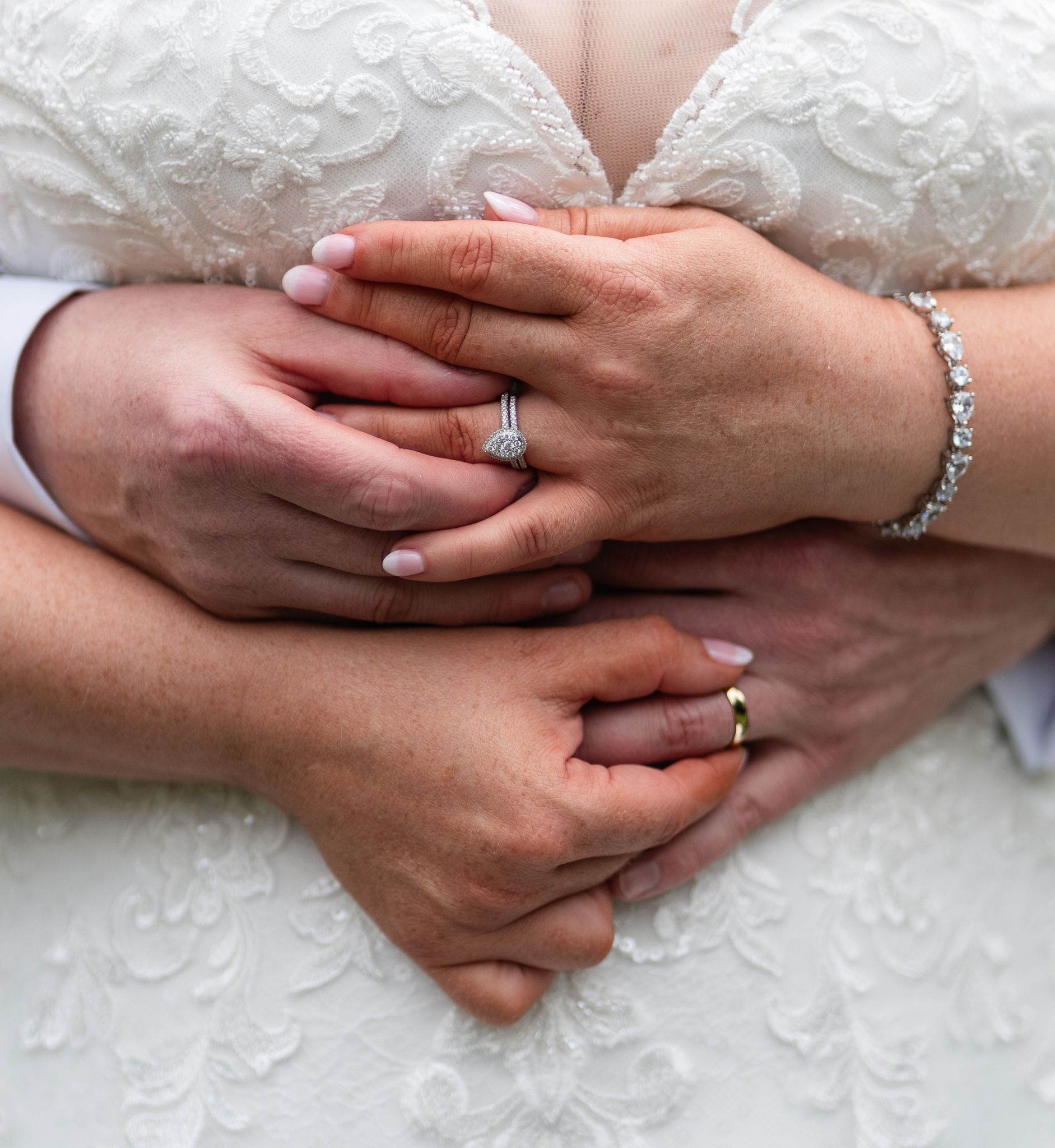 Bride holding a wildflower bouquet of cream and dusty pink blooms