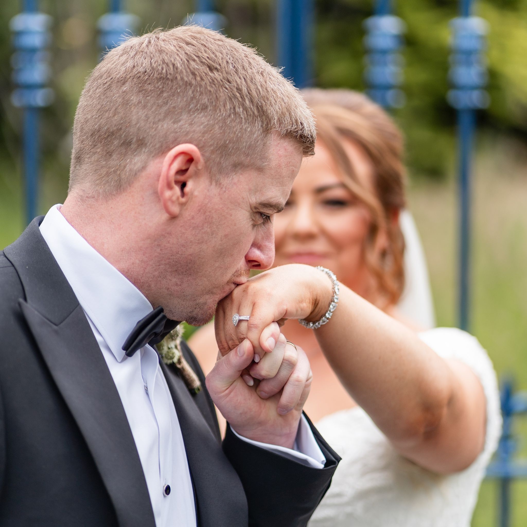 Groom seeing the bride for the first time and reacting with quiet emotion